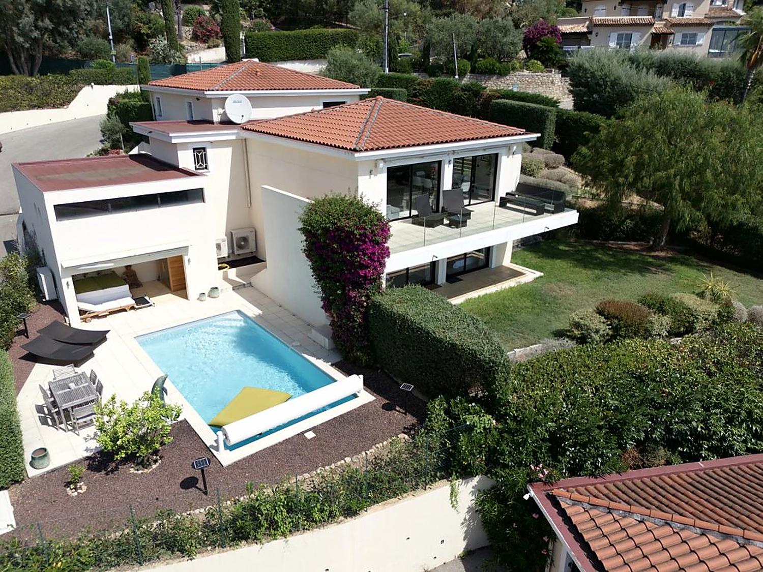 The villa, its pool and Mediterranean garden seen from above
